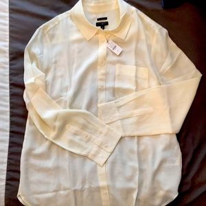 Long sleeved silk blouse.